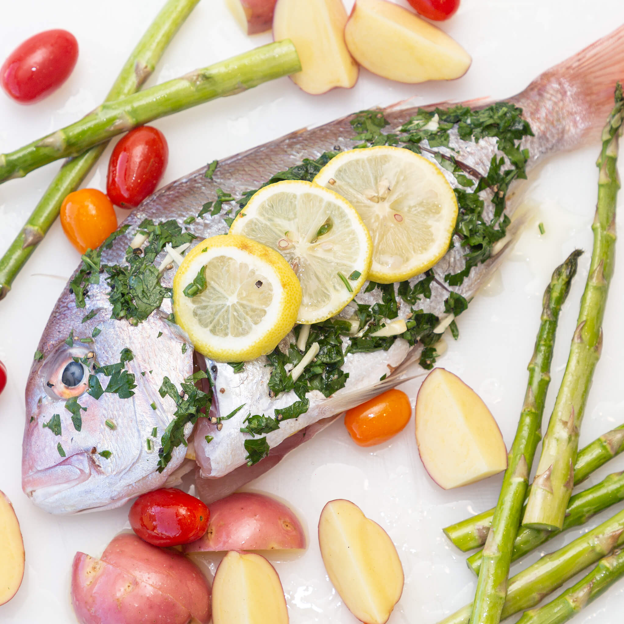  marinated New Zealand line caught Snapper in fresh lemons, parsley, garlic, olive oil, salt and pepper. DIY kit SERVE 2