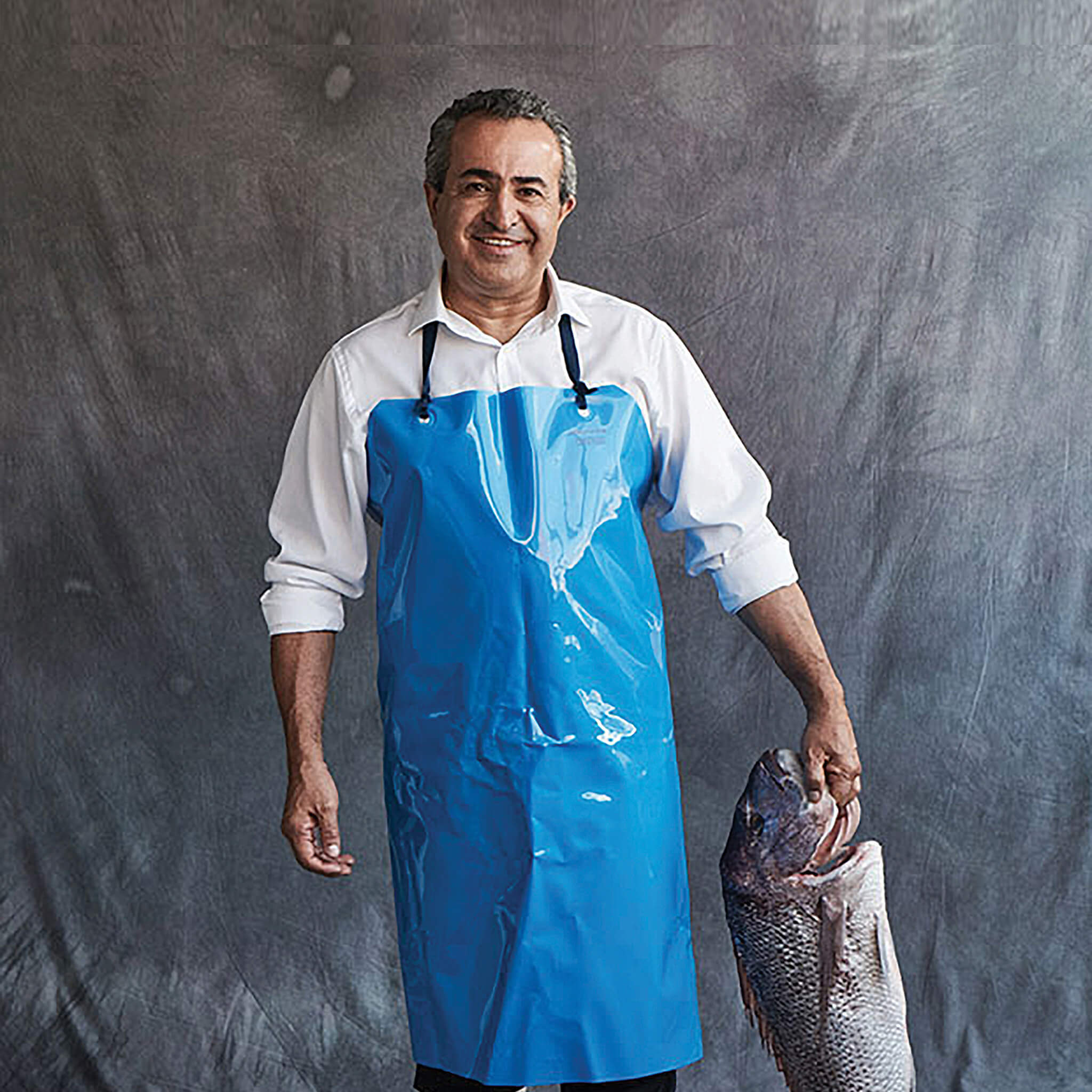 Steve Costi the owner of Steve Costi's Seafood fish a fresh fish