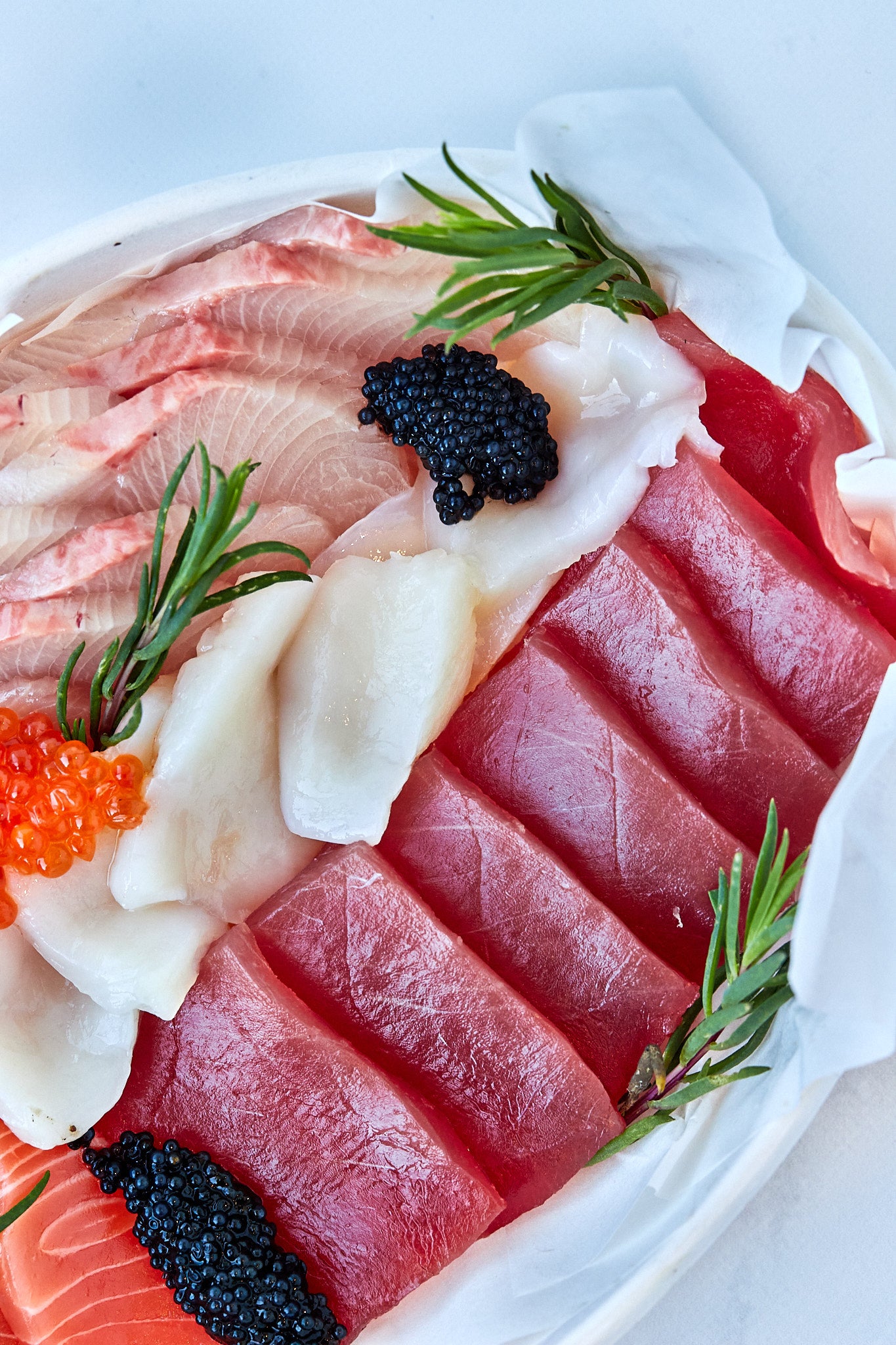 Sashimi platter from steve costi seafood with  scallops, caviar, salmon, tuna sashimi